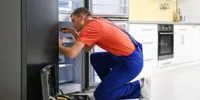 Refrigerator repair technician